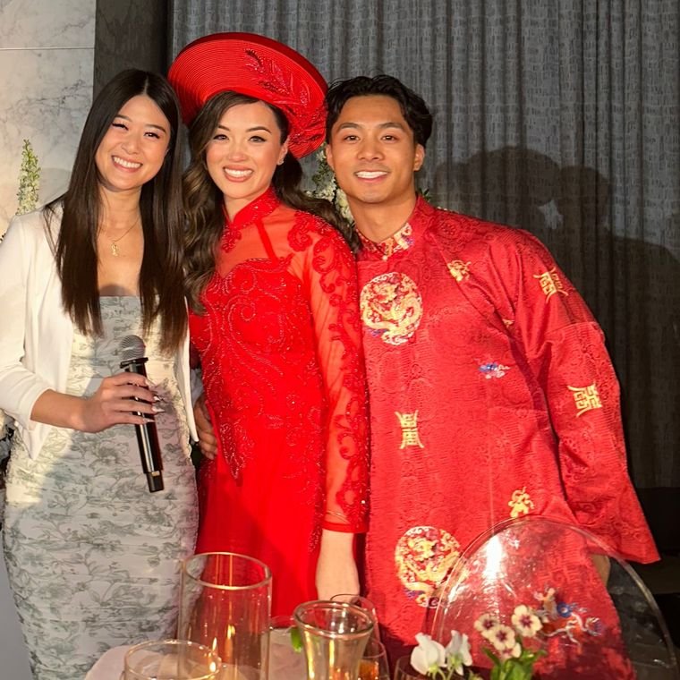 Lisa with a bride and groom in traditional Vietnamese áo dài